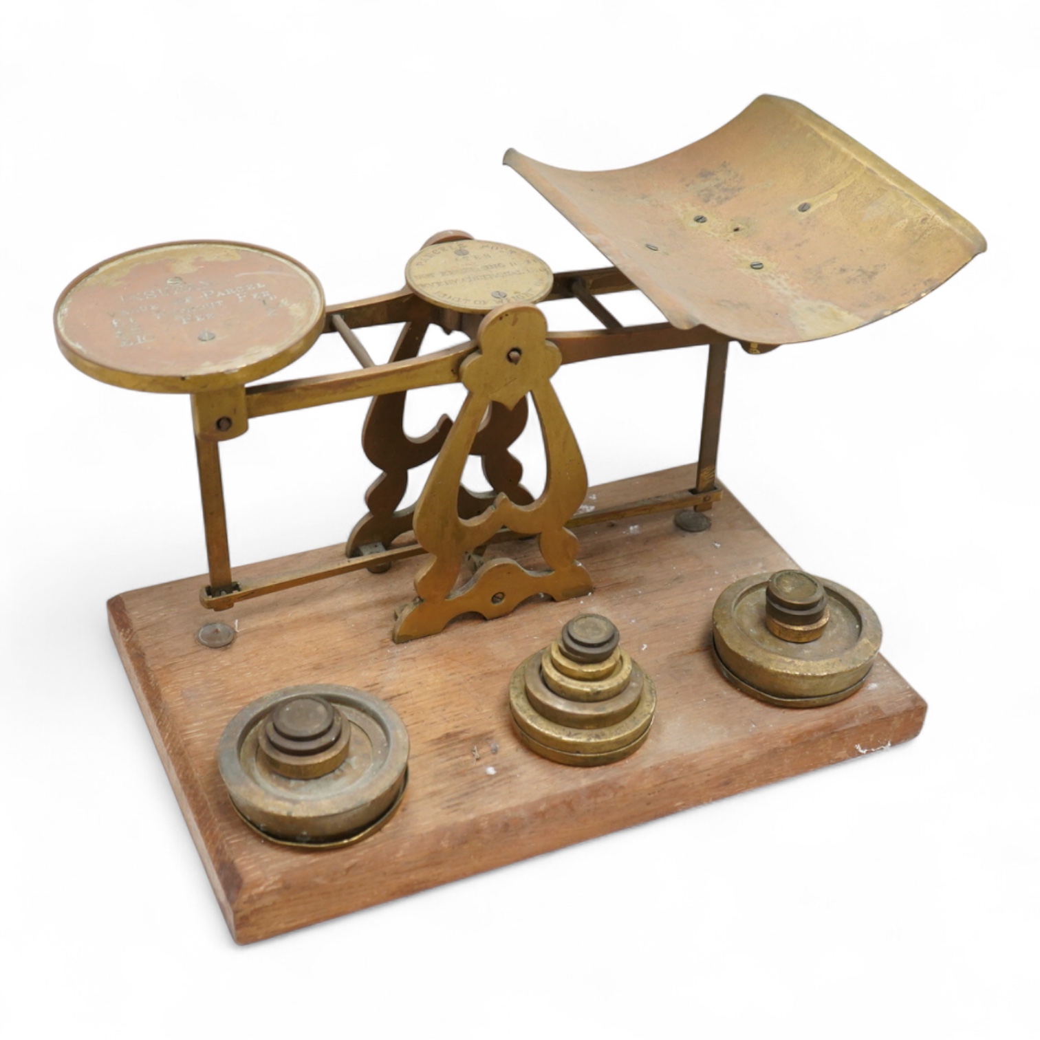 A set of brass and mahogany Avery postal scales and weights, 37cm wide